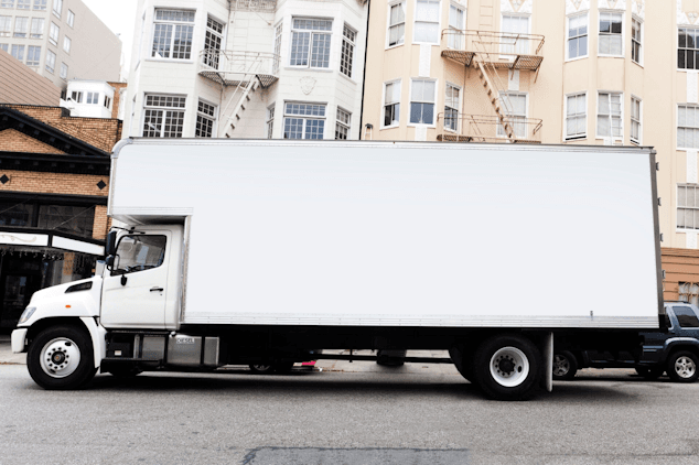 Moving truck parked on a residential street
